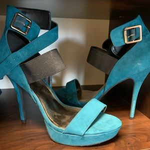 Blue suede platform high heeled sandals.
